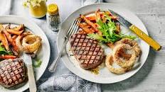 Steak, sweet potato fries and baked onion rings Thumbnail