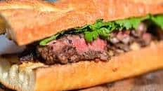 Grilled Jalapeño-Marinated Steak Sandwiches With Charred Onions and Cotija Mayo Recipe