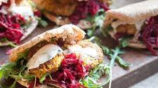 Harissa falafels with spiced beetroot, kefir dressing & pittas