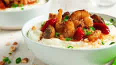 Spicy Cajun Shrimp and Cheddar Grits with roasted peppers and mushrooms