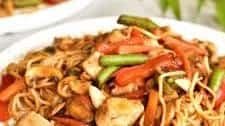 Sweet and sour chicken with noodles and vegetables