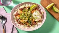 Sweet Potato and Refried Bean Burrito Bowl with Soured Cream and Cheese