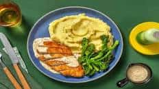 Ultimate Parmigiano Crumbed Chicken Schnitzel with Chive Mash, Mustard Cream Sauce and Tenderstem®