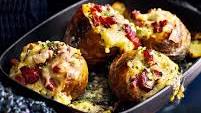 Baked potatoes stuffed with bacon, cheese and chives