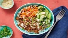 Beef Bulgogi Bowls with Carrots, Pickled Cucumber & Sriracha Crema over Jasmine Rice