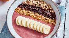 Cherry smoothie bowl with cacao nibs and muesli