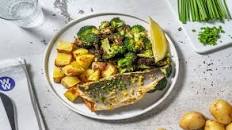 Lemon and Herb Sea Bass in Garlic Butter with Roast Potatoes and Broccoli