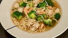 Noodle soup with chicken, broccoli and shrimps