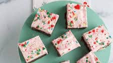 Pink Peppermint Christmas Brownies with White Chocolate Frosting
