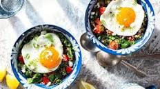 Quinoa-spinach grain bowls with feta, fried eggs, and fresh dill