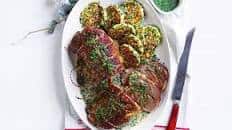 Curtis Stone’s herbed lamb roast with zucchini-fetta fritters