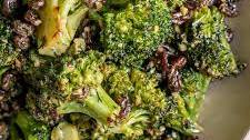 Garlic Roasted Broccoli with Dill Harissa Tahini and Raisins