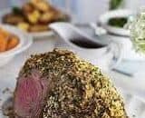 Herb-crusted leg of lamb with red wine gravy
