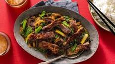 Mongolian beef and spinach stir-fry over steamed rice