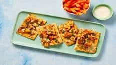 Spicy Buffalo Cauliflower Flatbreads with Mozzarella, Scallions, Carrot Sticks & Ranch Dressing