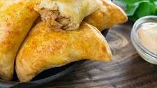 Spicy Garlic Braised Pork Empanadas with Piri Piri Yogurt
