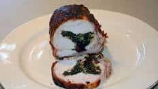 Wood Fired Kale-Stuffed Pork Loin with Cranberries and Pine Nuts