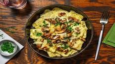 Mushroom Ravioli and Creamy Pesto Sauce with Burst Tomatoes and Toasted Walnuts