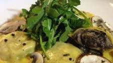 Mushroom Ravioli with Light Thyme Brodo, Peppery Arugula Salad and Truffle Oil