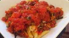 Pasta in spicy chorizo tomato sauce with capers