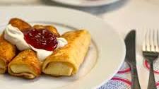 Perfect Cheese Blintzes with Strawberries and Sour Cream