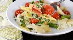 Spinach and Ricotta Ravioli topped with Asparagus and Tomato Sauté with Fresh Crab and Parmesan