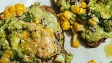 Avocado on toast with quinoa, maize and pesto