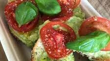 Bagels with avocado, tomato and basil