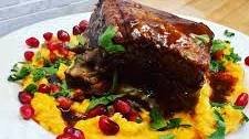 Braised Beef Short Ribs with Pomegranate Molasses Jus on Sweet Potato Mash