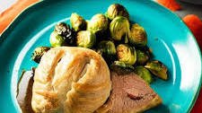 Classic Beef Wellington with Creamy Garlic Mashed Potatoes and Roasted Brussels Sprouts