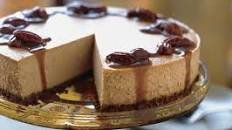Spiced Pumpkin Cheesecake with Caramel-Bourbon Sauce