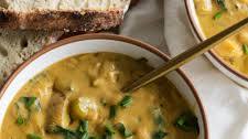 vegan creamy potato soup with beans and spinach