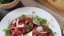 Beef Carpaccio with Capers, Rocket and Shavings of Grana Padano Riserva