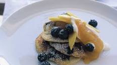 Blueberry pancakes with mango butter and cream