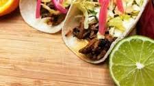 Chipotle Orange Brisket Tacos with Jalapeno Lime Slaw