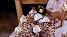 Chocolate hazelnut yule log with meringue mushrooms