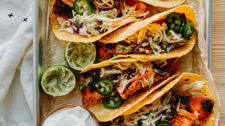 Grain-Free Salmon Tacos with Spicy Cabbage Slaw and Lime Crema