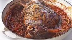 Herby baked lamb in tomato sauce