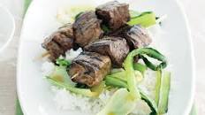 Honey-soy beef skewers with stir-fried Asian greens