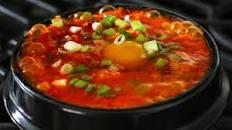 Kimchi sundubu-jjigae (김치순두부찌개) Spicy soft tofu stew with kimchi...