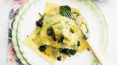 Ricotta and herb ravioli with spinach and pine nuts