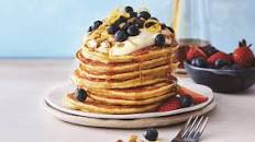 Ricotta pancakes with berries and lemon honey sauce