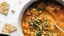 Spicy Peanut Soup with Sweet Potato + Kale