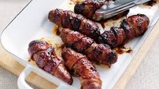 Sticky bacon-wrapped sausages