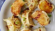 Vegan dumplings with spicy dipping sauce