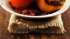 lamb-stuffed peppers in spiced tomato sauce