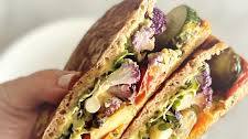 toasted stuffed hummus and roasted cucumber pita sandwich