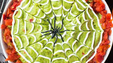 Halloween Guacamole with Sour Cream Spiderwebs