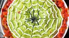 Halloween Guacamole with Sour Cream Spiderwebs
