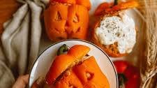 Jack-o’-lantern stuffed peppers